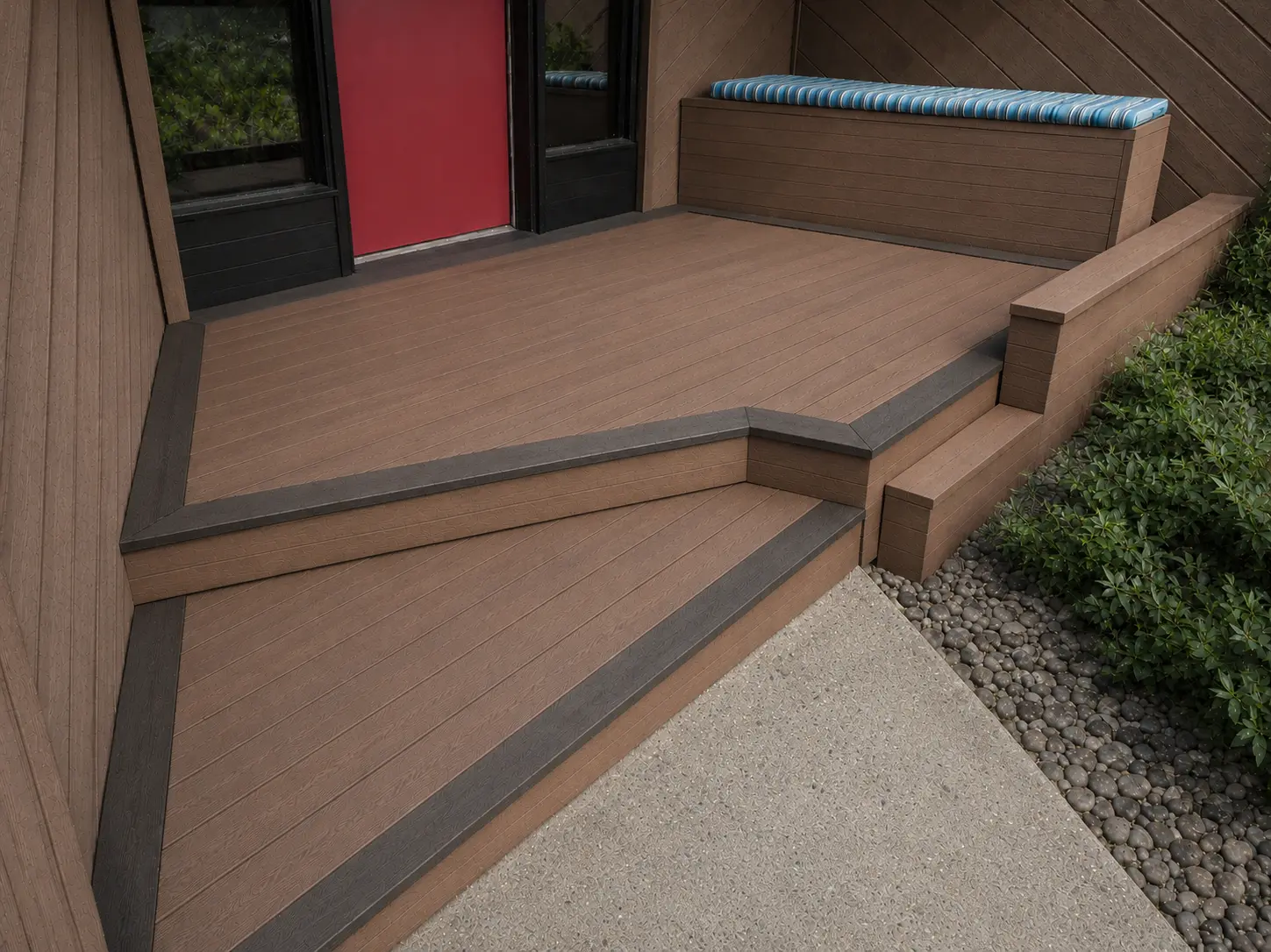 TimberTech deck refacing design with Mahogany decking, Dark Hickory picture-frame border, and a two-tier garden wall